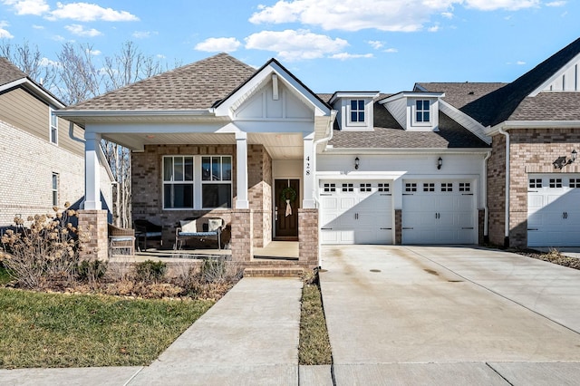 craftsman inspired home with a porch and a garage