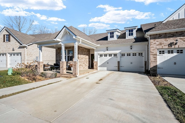 view of front of home featuring a garage and a porch