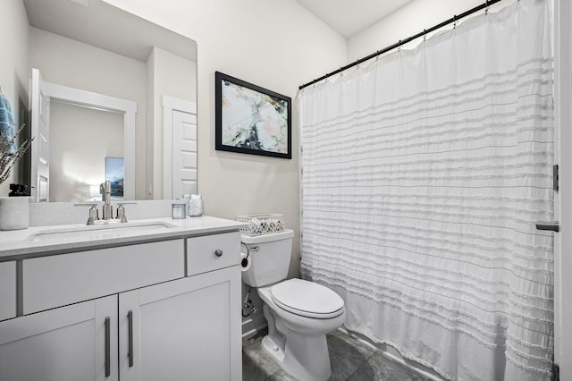 bathroom with walk in shower, vanity, and toilet