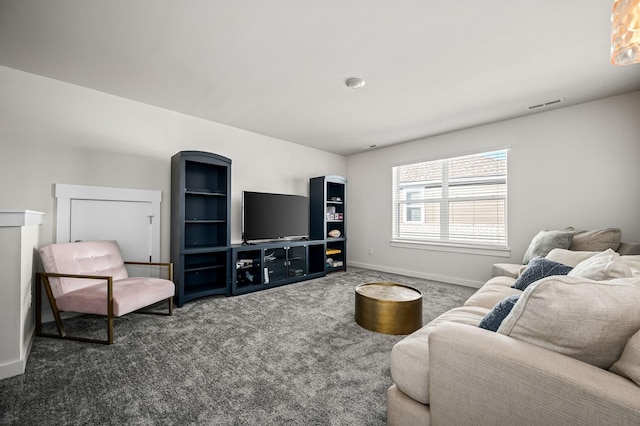 living room featuring dark colored carpet