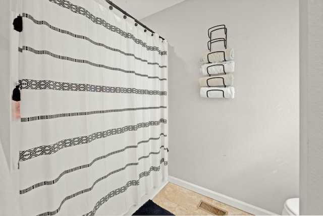 bathroom featuring tile patterned flooring