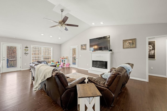 living room with lofted ceiling, dark wood-type flooring, and ceiling fan