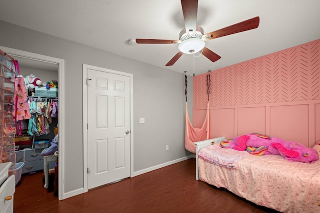 bedroom with ceiling fan and dark hardwood / wood-style flooring