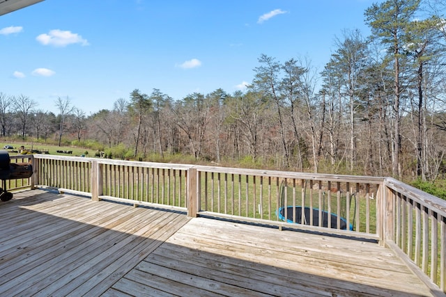 deck featuring a lawn