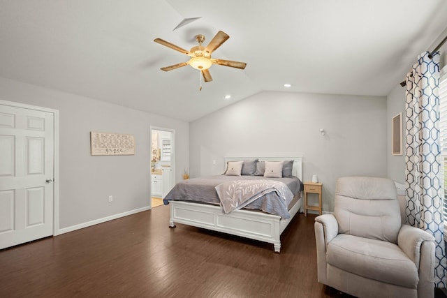 bedroom with lofted ceiling, dark wood-type flooring, ceiling fan, and ensuite bathroom