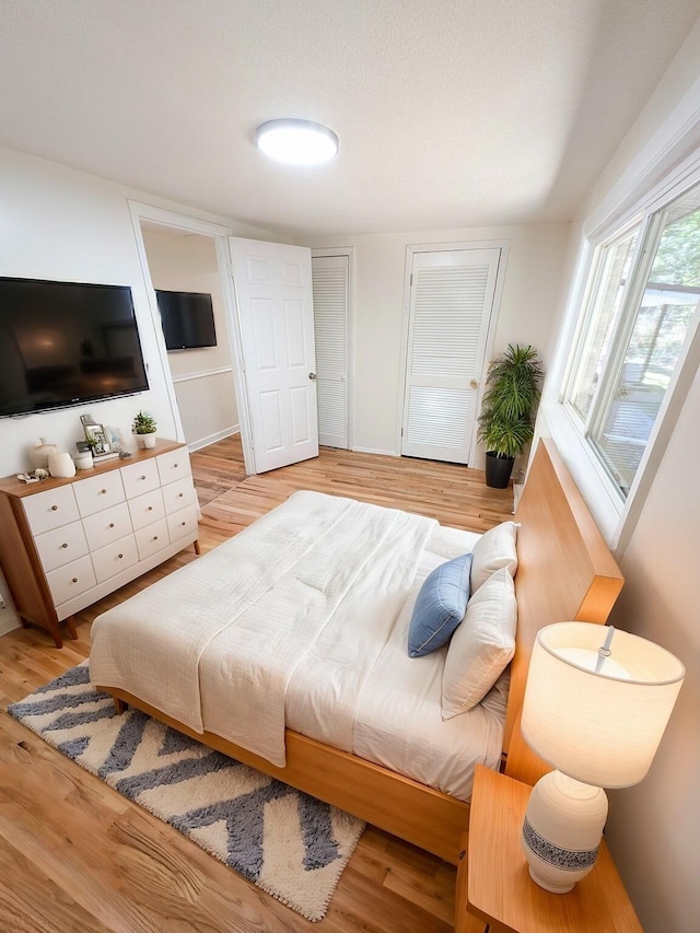 bedroom with light hardwood / wood-style flooring