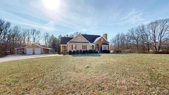 view of front of property featuring a garage, concrete driveway, a chimney, and a front lawn