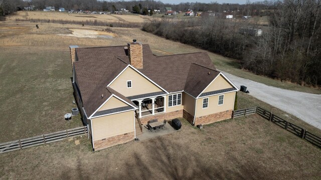 birds eye view of property featuring a rural view