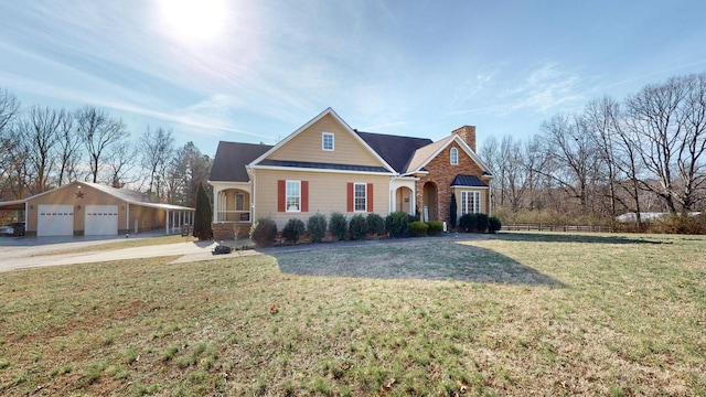 traditional-style home featuring a garage, a front lawn, a chimney, and brick siding