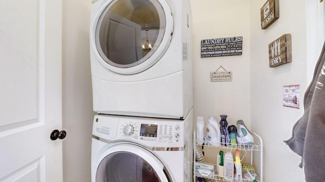 laundry area with stacked washer and dryer