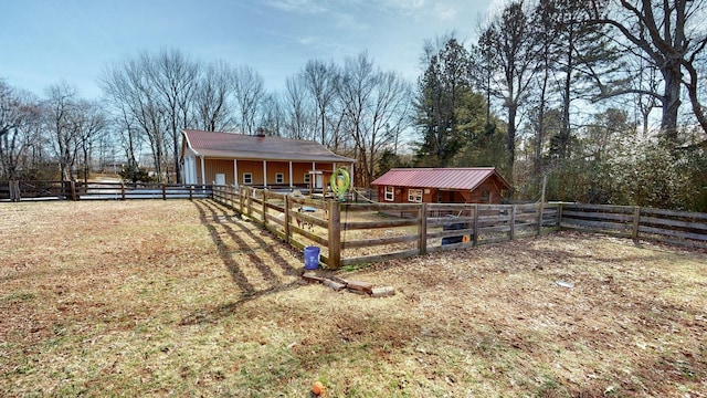 rear view of house with an outbuilding and an exterior structure