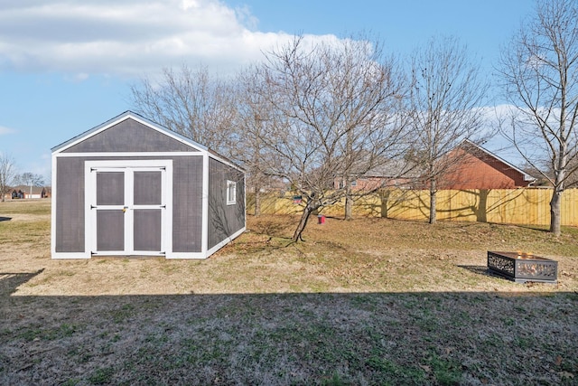 exterior space with a fire pit and a lawn