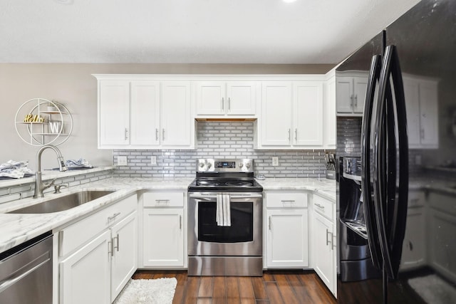 kitchen featuring white cabinetry, sink, and appliances with stainless steel finishes