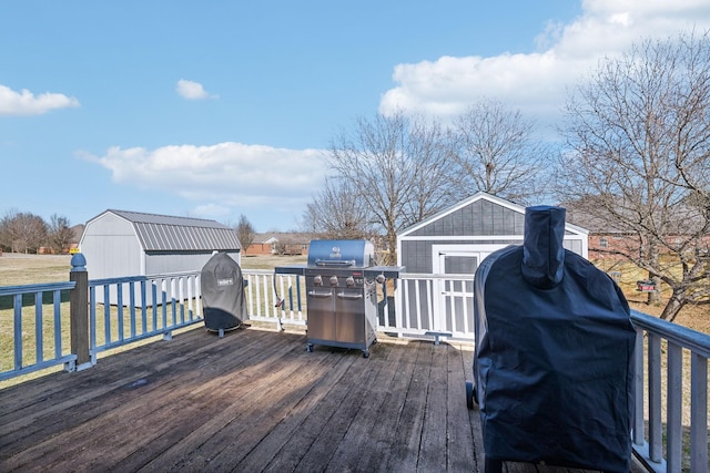 wooden terrace featuring area for grilling and a storage shed