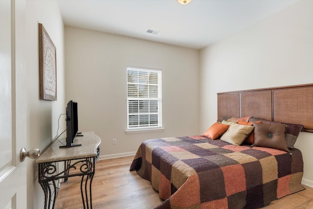 bedroom with light hardwood / wood-style flooring