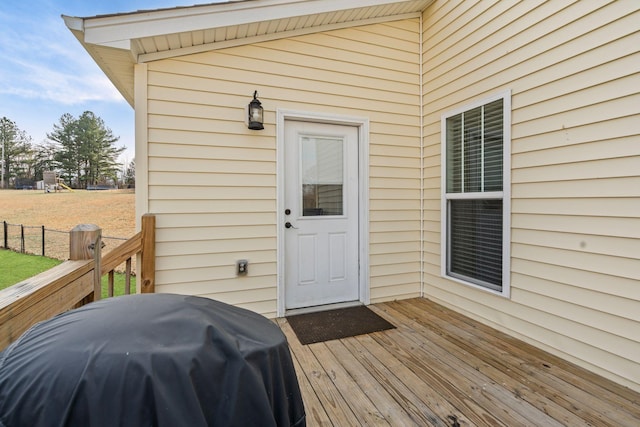 wooden deck featuring area for grilling