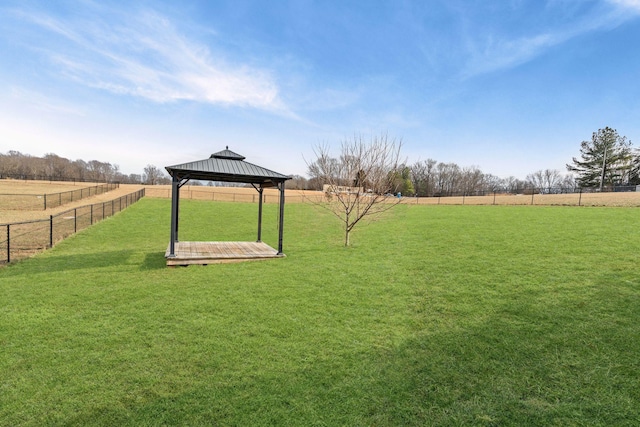 view of yard featuring a gazebo and a rural view