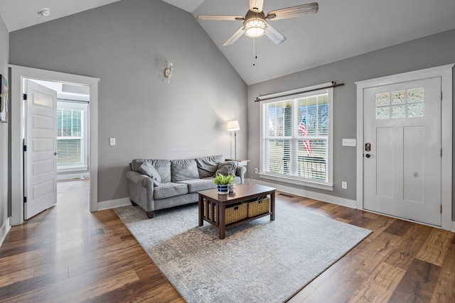 living room with lofted ceiling, hardwood / wood-style floors, and ceiling fan