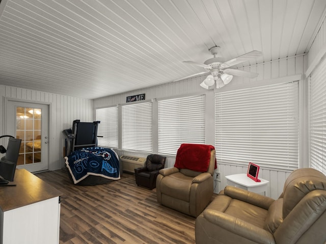 living room with ceiling fan and dark hardwood / wood-style flooring