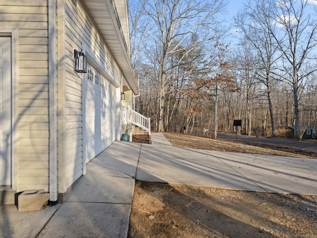 view of side of property with a garage