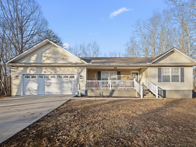 single story home featuring a garage and a porch