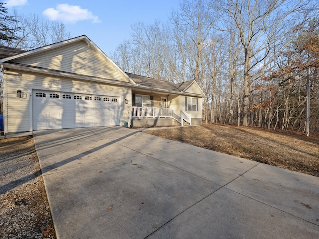 view of front of home with a garage and a porch