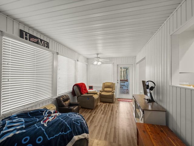 bedroom with ceiling fan and light wood-type flooring