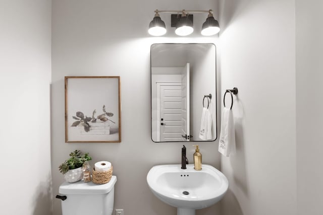 bathroom featuring sink and toilet