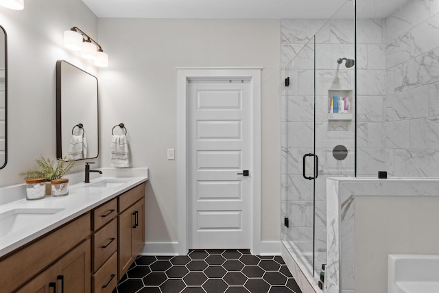 bathroom featuring vanity and a shower with shower door