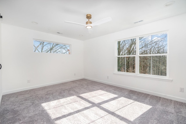 carpeted empty room with ceiling fan