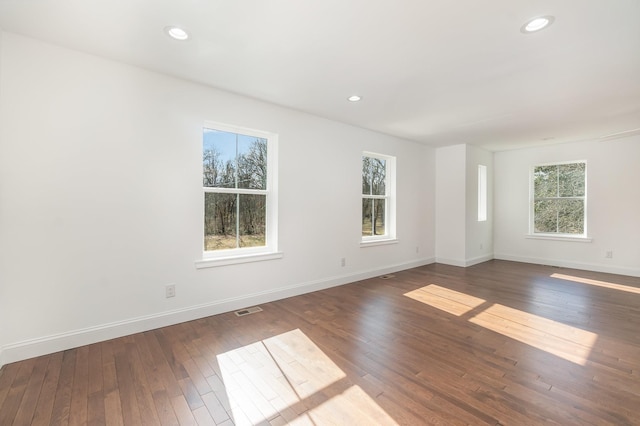 spare room featuring dark hardwood / wood-style floors