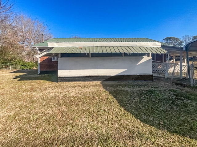 view of side of home featuring a yard