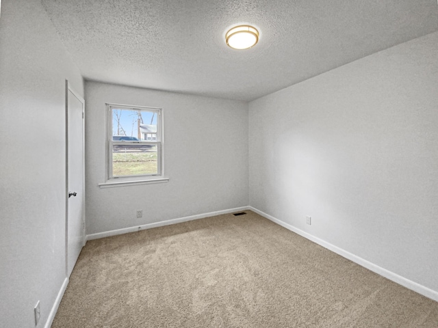 615 Lafayette Ct, Clarksville, TN 37042 - carpeted spare room with baseboards, a textured ceiling, and visible vents
