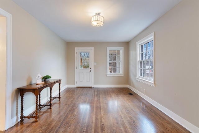 entrance foyer with dark hardwood / wood-style floors