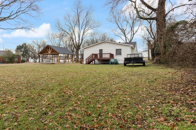 view of yard featuring a gazebo and a wooden deck