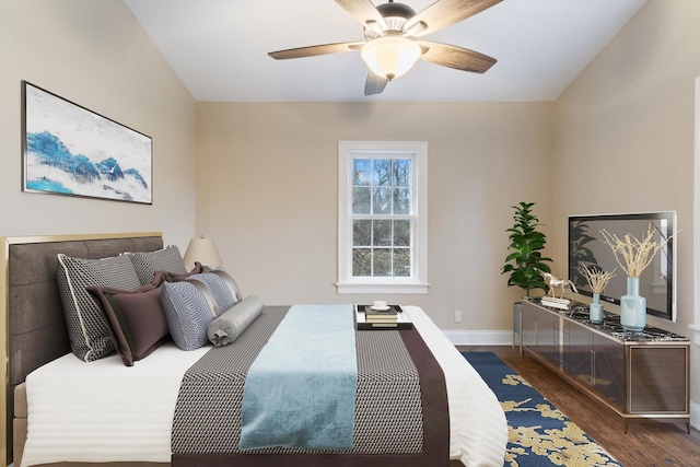 bedroom with ceiling fan and dark hardwood / wood-style flooring