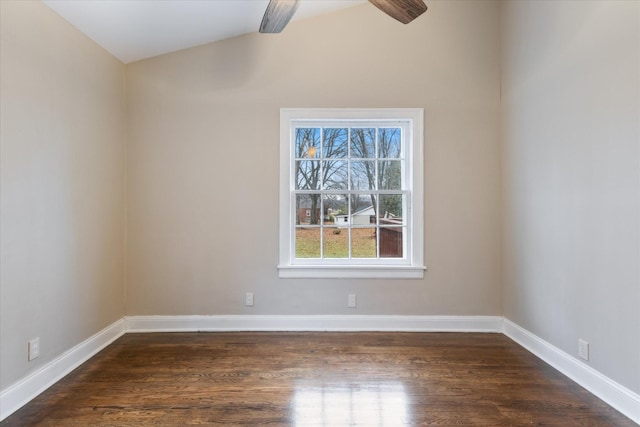 empty room featuring ceiling fan and dark hardwood / wood-style flooring