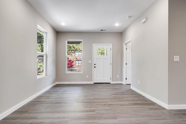 foyer with light hardwood / wood-style floors