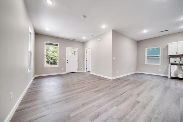 unfurnished living room with light hardwood / wood-style flooring