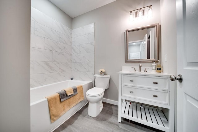 full bathroom featuring vanity, tiled shower / bath combo, toilet, and hardwood / wood-style flooring