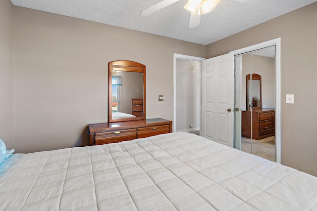 unfurnished bedroom with ceiling fan, a closet, and a textured ceiling