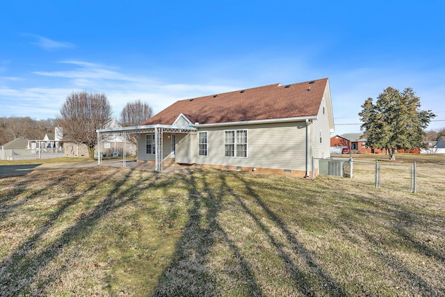 back of property featuring a yard and a patio