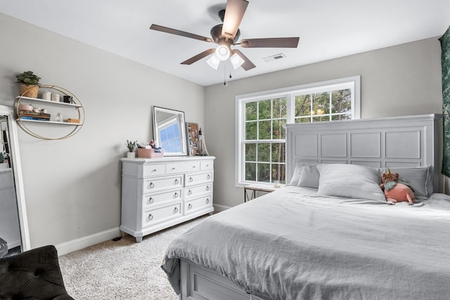 bedroom featuring ceiling fan and carpet