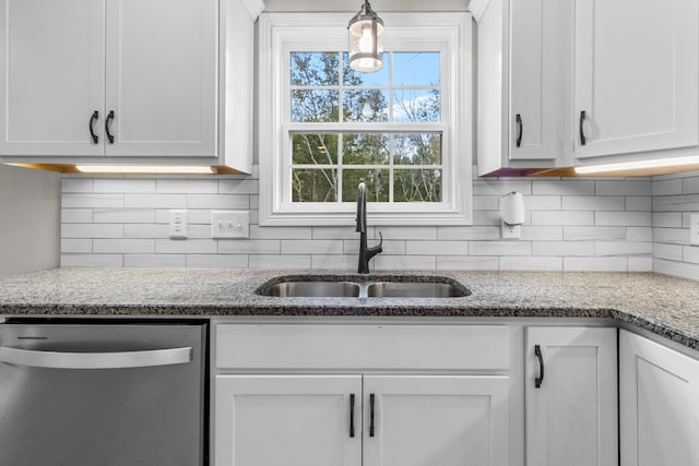 kitchen featuring white cabinetry, sink, and stainless steel dishwasher