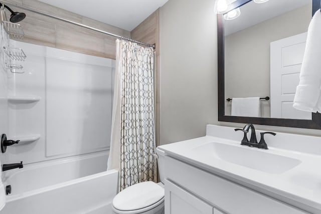 full bathroom with vanity, toilet, and shower / bath combo with shower curtain