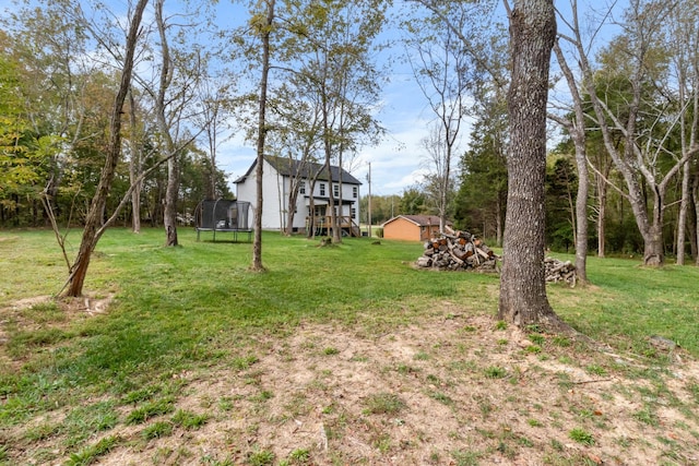 view of yard with a trampoline