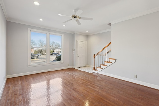 entrance foyer featuring crown molding, ceiling fan, and light wood-type flooring