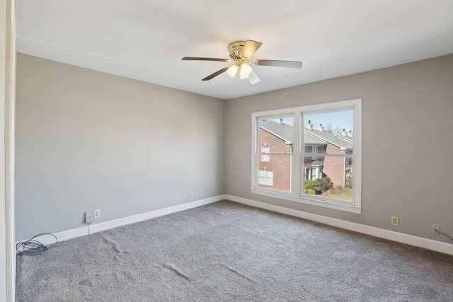 empty room featuring ceiling fan and carpet flooring