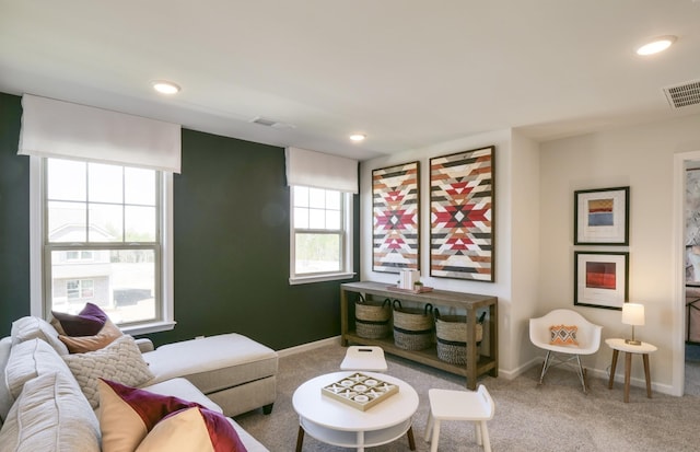 living room with recessed lighting, carpet, visible vents, and baseboards