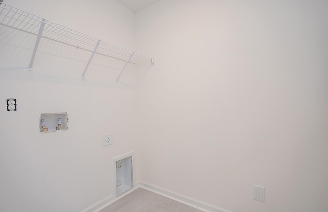 washroom featuring laundry area, hookup for a washing machine, electric dryer hookup, and baseboards